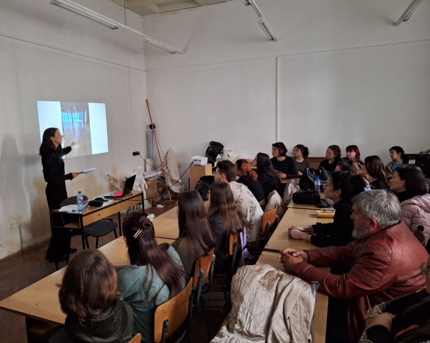 Daniela Borisova delivering a lecture on contemporary art in university