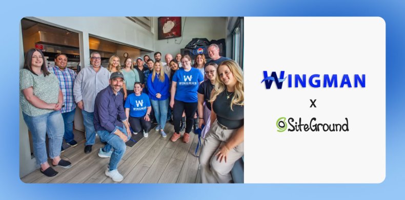 A photo of Wingman Planning's team standing together in an office setting, with several people wearing blue Wingman branded t-shirts. The image includes both the Wingman and SiteGround logos displayed prominently.